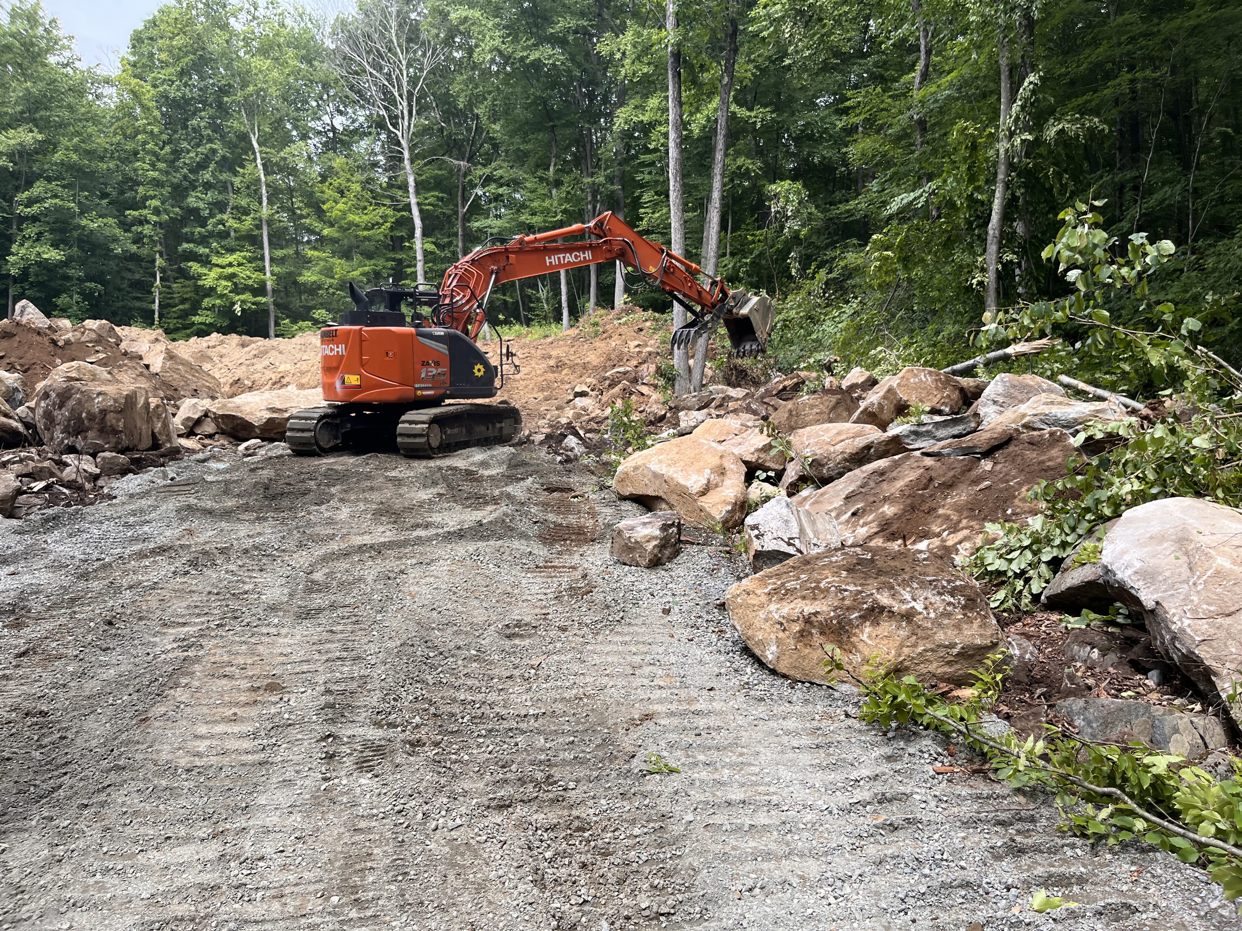 Filled in driveway with the execvator and rocks