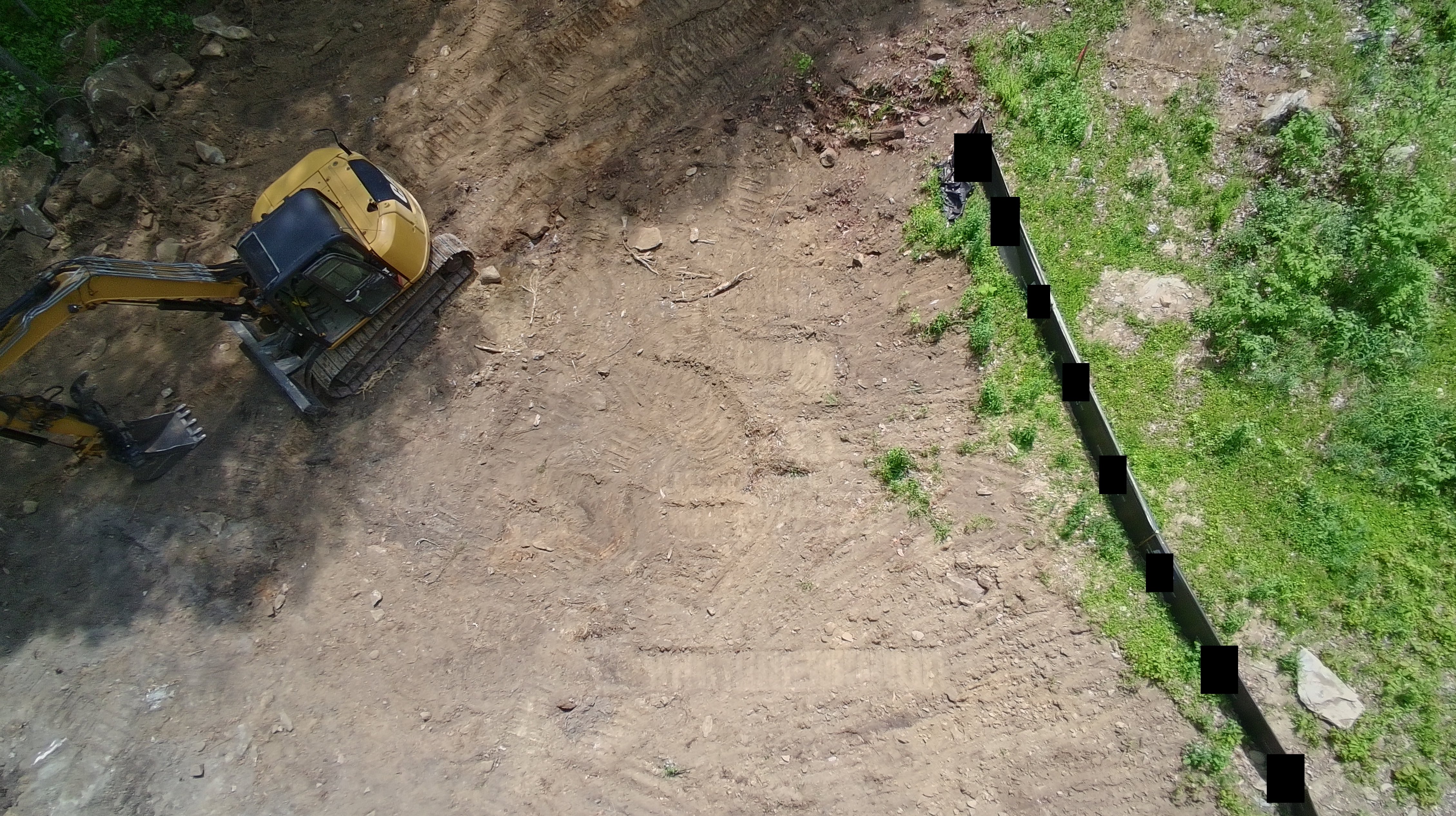 Drone looking at excavator